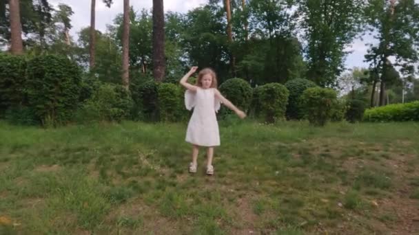Baby Angel Wings Runs Park Grass Arms Wide Apart Rejoices — Stock Video
