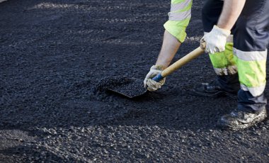 asphalt in the city operators working with tools and uniform clipart