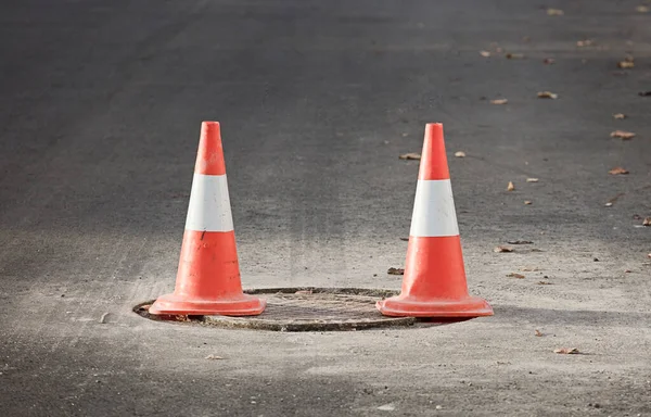 road hazard signaling cones. on road maintenance works