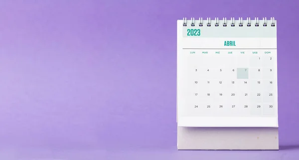 Desk calendar for the month of April 2023 with a purple lilac background