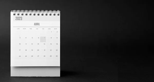 Desk calendar for the month of April 2023 with dark black background