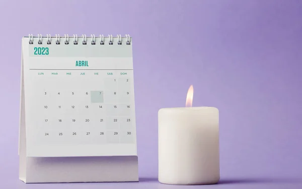 calendar month of april with lit candle, christian reminder, holy week