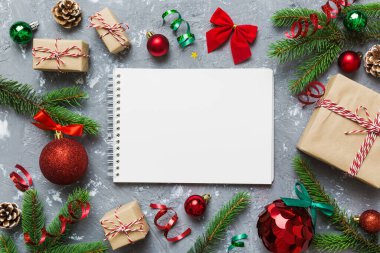 Christmas blank greeting card mock-up scene. Creative layout made of Christmas tree branches and paper card note. Flat lay. Nature New Year concept.