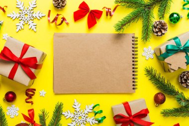 Christmas blank greeting card mock-up scene. Creative layout made of Christmas tree branches and paper card note. Flat lay. Nature New Year concept.