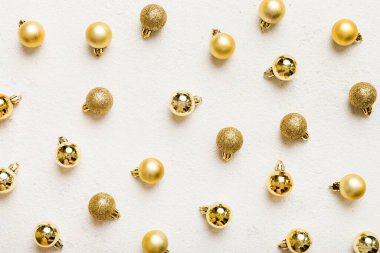 Christmas composition. a pattern of christmas balls on colored background. Flat lay, top view New year decor.