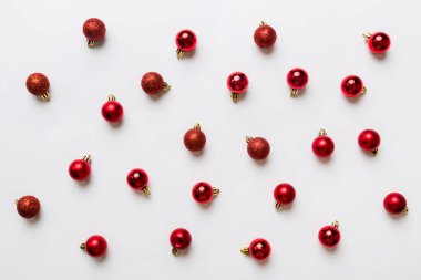 Christmas composition. a pattern of christmas balls on colored background. Flat lay, top view New year decor.