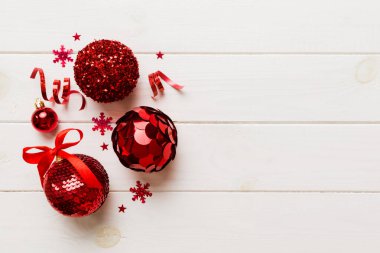 Christmas ball on colored background. decoration bauble with ribbon bow with copy space.