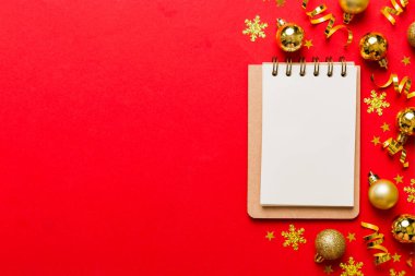 Christmas blank greeting card mock-up scene. Creative layout made of Christmas tree branches and paper card note. Flat lay. Nature New Year concept.