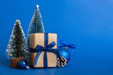 Christmas composition. Gifts, small tree, branches and craft DIY decorations on white background. New year concept. Christmas home decoration Flat lay, top view, copy space.