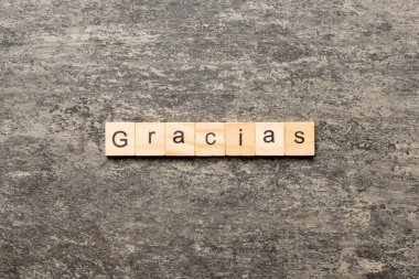 gracias word written on wood block. gracias text on table, concept.
