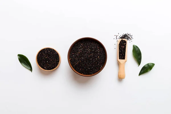 stock image quinoa seeds in bowl and spoon on colored background. Healthy kinwa in small bowl. Healthy superfood.