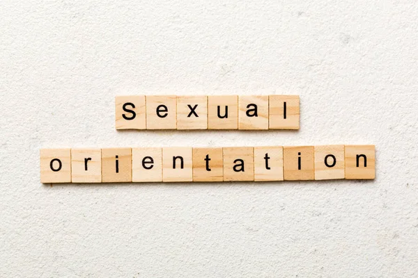 Sexual orientation word written on wood block. Sexual orientation text on cement table for your desing, concept.