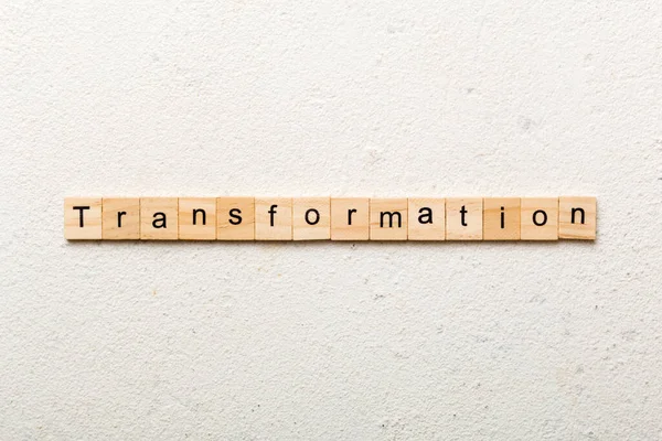 stock image transformation word written on wood block. transformation text on table, concept.