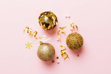 Christmas ball on colored background. decoration bauble with ribbon bow with copy space.