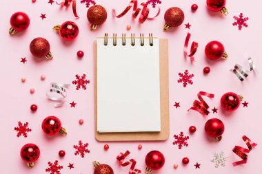 Christmas blank greeting card mock-up scene. Creative layout made of Christmas tree branches and paper card note. Flat lay. Nature New Year concept.