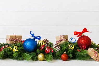 New Year Christmas tree toy, branches of a christmas tree, New Year decorations on a colored background.