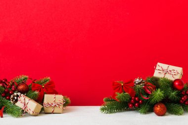 New Year Christmas tree toy, branches of a christmas tree, New Year decorations on a colored background.