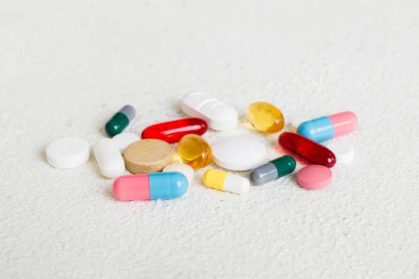 stock image Many different colorful medication and pills perspective view. Set of many pills on colored background.