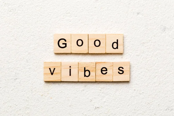 stock image good vibes word written on wood block. good vibes text on table, concept.