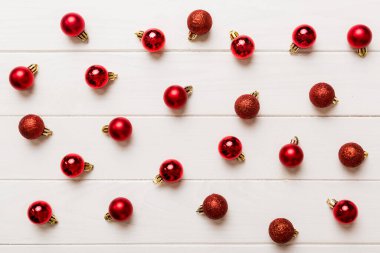 Christmas composition. a pattern of christmas balls on colored background. Flat lay, top view New year decor.