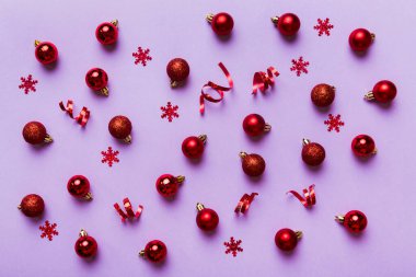 Christmas composition. a pattern of christmas balls on colored background. Flat lay, top view New year decor.