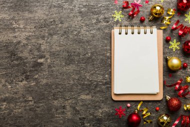 Christmas blank greeting card mock-up scene. Creative layout made of Christmas tree branches and paper card note. Flat lay. Nature New Year concept.