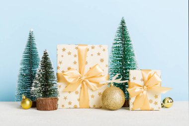 Christmas composition. craft Gift box, small tree, branches and craft DIY decorations on white background. New year concept. Christmas home decoration Flat lay, top view, copy space.