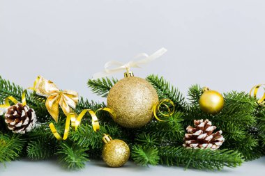 New Year Christmas tree toy, branches of a christmas tree, New Year decorations on a colored background.