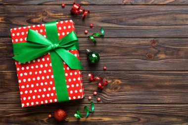 Top view Flat lay Christmas decorations and gift box on colored background with copy space. Christmas or Happy New Year composition.