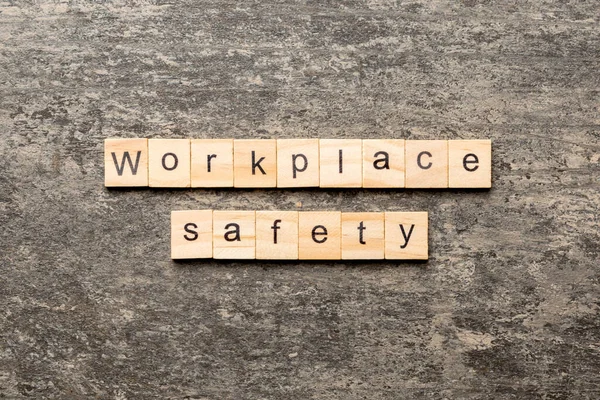 workplace safety word written on wood block. workplace safety text on table, concept.