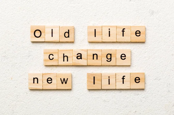 old life change new life word written on wood block. old life change new life text on table, concept.