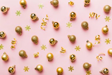 Christmas composition. a pattern of christmas balls on colored background. Flat lay, top view New year decor.