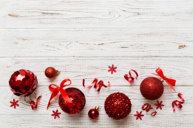 Christmas ball on colored background. decoration bauble with ribbon bow with copy space.