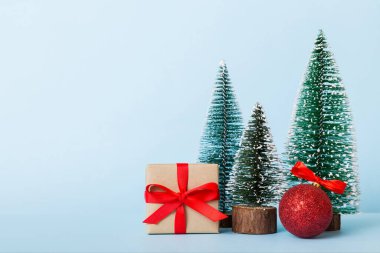 Christmas composition. craft Gift box, small tree, branches and craft DIY decorations on white background. New year concept. Christmas home decoration Flat lay, top view, copy space.