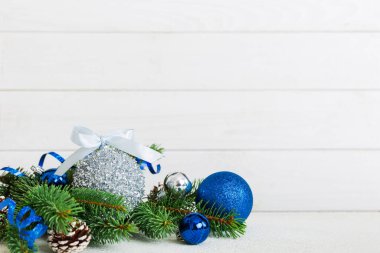 New Year Christmas tree toy, branches of a christmas tree, New Year decorations on a colored background.