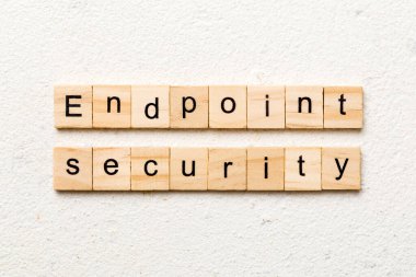 endpoint security word written on wood block. endpoint security text on table, concept.