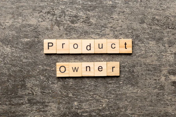 product owner word written on wood block. product owner text on table, concept.