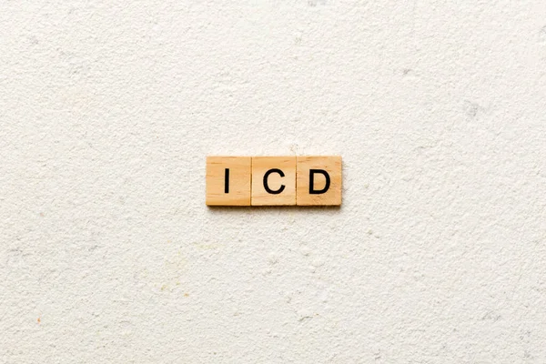 木のブロックに書かれたIcdワード 表上の国際分類疾患のテキスト — ストック写真