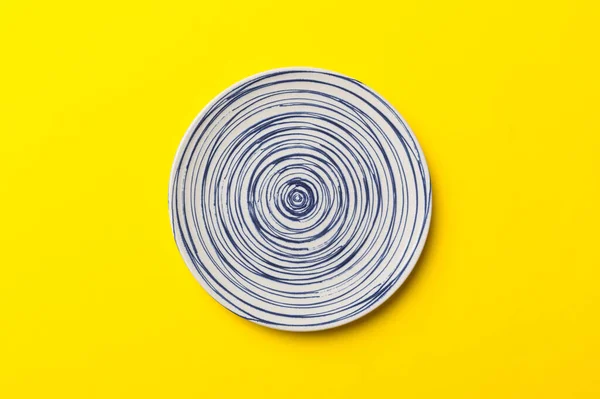 stock image Top view of isolated of colored background empty round blue plate for food. Empty dish with space for your design.