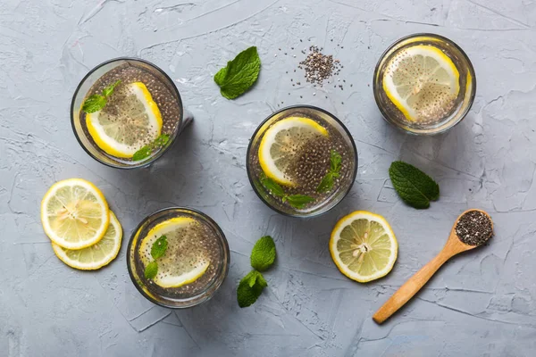 stock image Healthy breakfast or morning with chia seeds lemon and mint on table background, vegetarian food, diet and health concept. Chia pudding with lemon and mint.