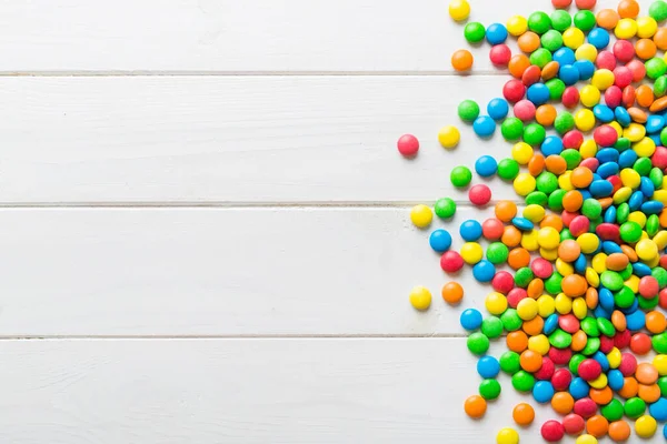 stock image Mixed collection of colorful candy, on colored background. Flat lay, top view. frame of colorful chocolate coated candy.