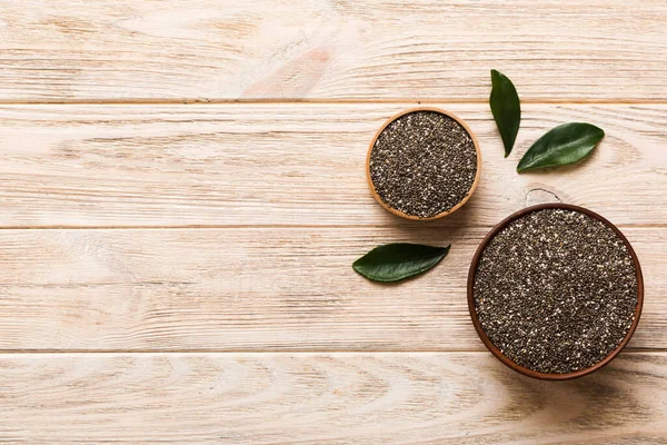 stock image Chia seeds in bowl on colored background. Healthy Salvia hispanica in small bowl. Healthy superfood.