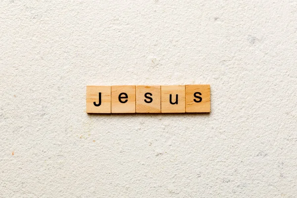 stock image Jesus word written on wood block. Jesus text on table, concept.
