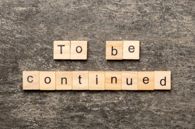 Tahta blokta yazılacak kelime devam edecek. İfadeniz için çimento masadaki metne devam edilecek..