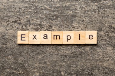 Tahta bloğa yazılmış örnek bir kelime. Örneğin tablo üzerinde metin, konsept.