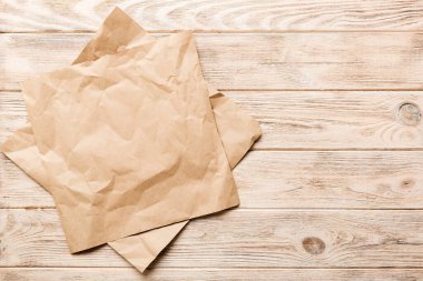 top view with baking parchment empty on table background. Folded cloth for mockup with copy space, Flat lay. Minimal style.