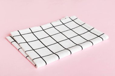 top view with white empty kitchen napkin isolated on table background. Folded cloth for mockup with copy space, Flat lay. Minimal style.