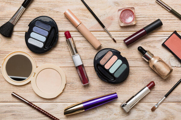 Professional makeup tools. Top view. Flat lay. Beauty, decorative cosmetics. Makeup brushes set and color eyeshadow palette on table background. Minimalistic style.