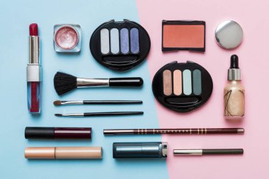 Professional makeup tools. Top view. Flat lay. Beauty, decorative cosmetics. Makeup brushes set and color eyeshadow palette on table background. Minimalistic style.
