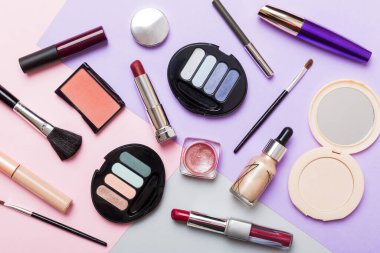 Professional makeup tools. Top view. Flat lay. Beauty, decorative cosmetics. Makeup brushes set and color eyeshadow palette on table background. Minimalistic style.